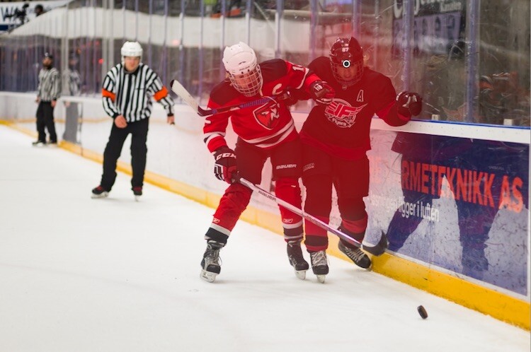 A hockey image with a adjustment brush applied to it - Tips for Editing Hockey Photos in Lightroom