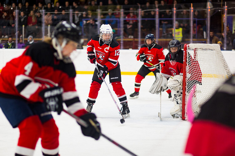 Hockey players wearing bright red hockey jerseys - Tips for Editing Hockey Photos in Lightroom