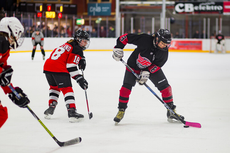 Hockey players fighting for the puck - Tips for Editing Hockey Photos in Lightroom
